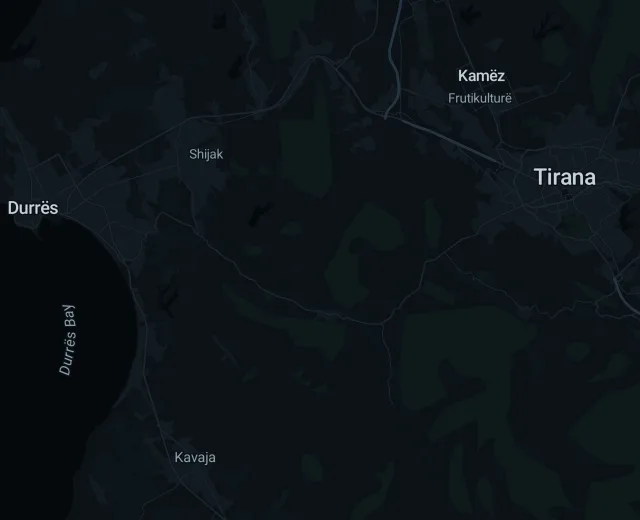Sample trip Tiranë → Kavajë on a night map of central Albania, the route coloured by speed